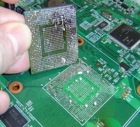 Laptop motherboard on a BGA rework station at Ram Infotech Chennai